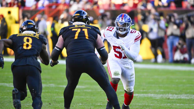 Nov 19, 2023; Landover, Maryland, USA; New York Giants linebacker Azeez Ojulari (51) rushes as Washington Commanders guard Andrew Wylie (71) blocks during the second half at FedExField.